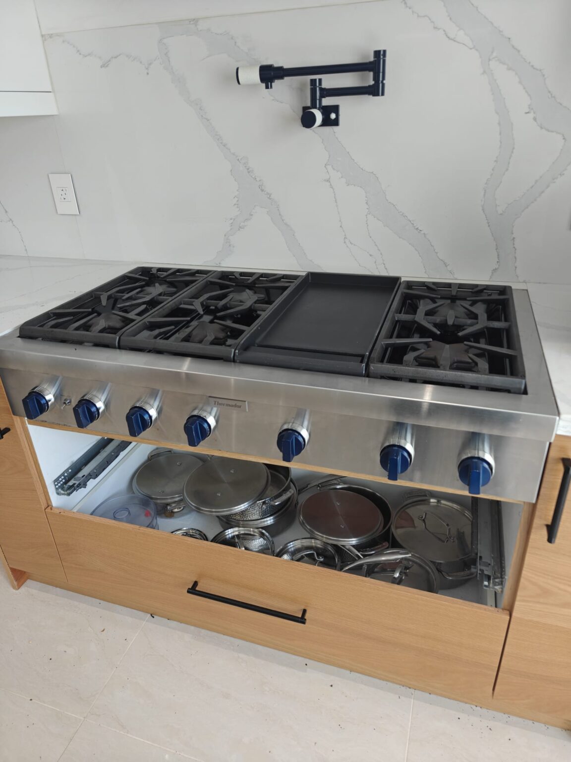 Thermador 48-inch professional gas rangetop with 6 burners and center griddle, stainless steel finish, appliance repair service in Toronto